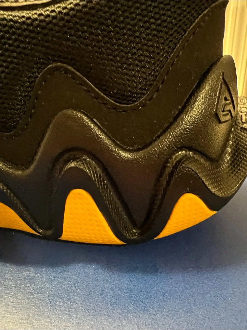 Nike Kids Black Sneakers with Yellow Accents and Multicolor Swoosh